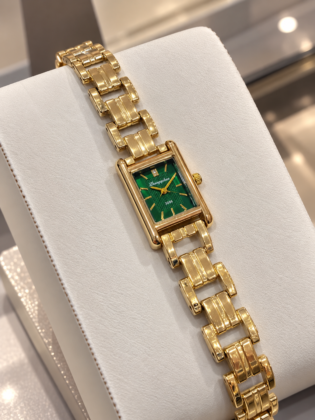 Emerald prestige gold watch